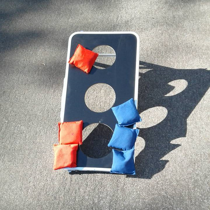 3 hole bean bag toss party game for rent from Big Blue Sky Party Rentals