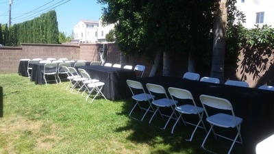 8 ft Rectangular Wood Table Rentals, Black Tablecloths and White Padded Chair Rentals