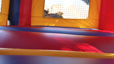 Inflatable Mini Bounce House Rental - Interior view of bouncing area and window.