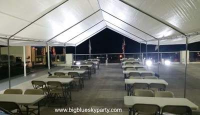 Party tent rental with beige chairs and tables in Los Angeles.