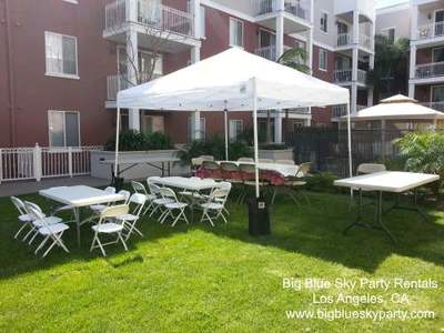 Beige folding chair rentals with party tent and kids rentals in Los Angeles.