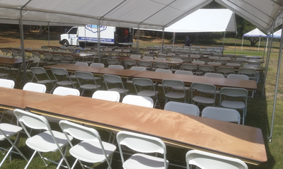 8 ft Rectangular Wood Table Rentals and White Folding Chair Rentals
