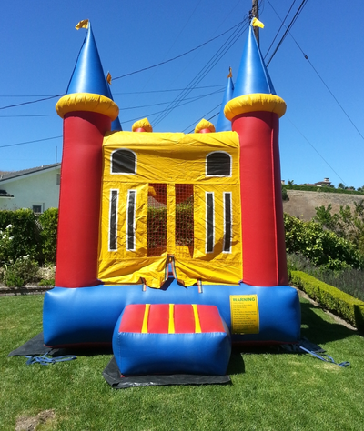 Inflatable Magic Bounce House Rental - backyard setup blue sky