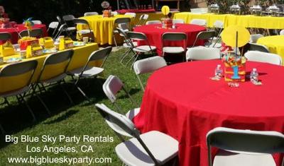 Beige chair rentals with tables and tablecloth rentals in Los Angeles.